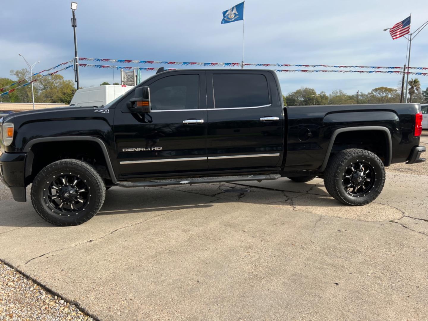 2015 Black /Tan GMC Sierra 2500HD Denali (1GT120E88FF) with an 6.6L Duramax Diesel engine, Allison Transmission transmission, located at 4520 Airline Hwy, Baton Rouge, LA, 70805, (225) 357-1497, 30.509325, -91.145432 - 2015 GMC Sierra 2500HD Crew Cab Denali 4WD 6.6 Duramax Diesel (Deleted), Allison Transmission, 211K Miles, Heated & Cooled Leather Seats, All Power, Backup Camera, Tow Pkg. NO IN HOUSE FINANCING. FOR INFO PLEASE CONTACT JEFF AT 225 357-1497 CHECK OUT OUR A+ RATING WITH THE BETTER BUSINESS BUREAU - Photo#1